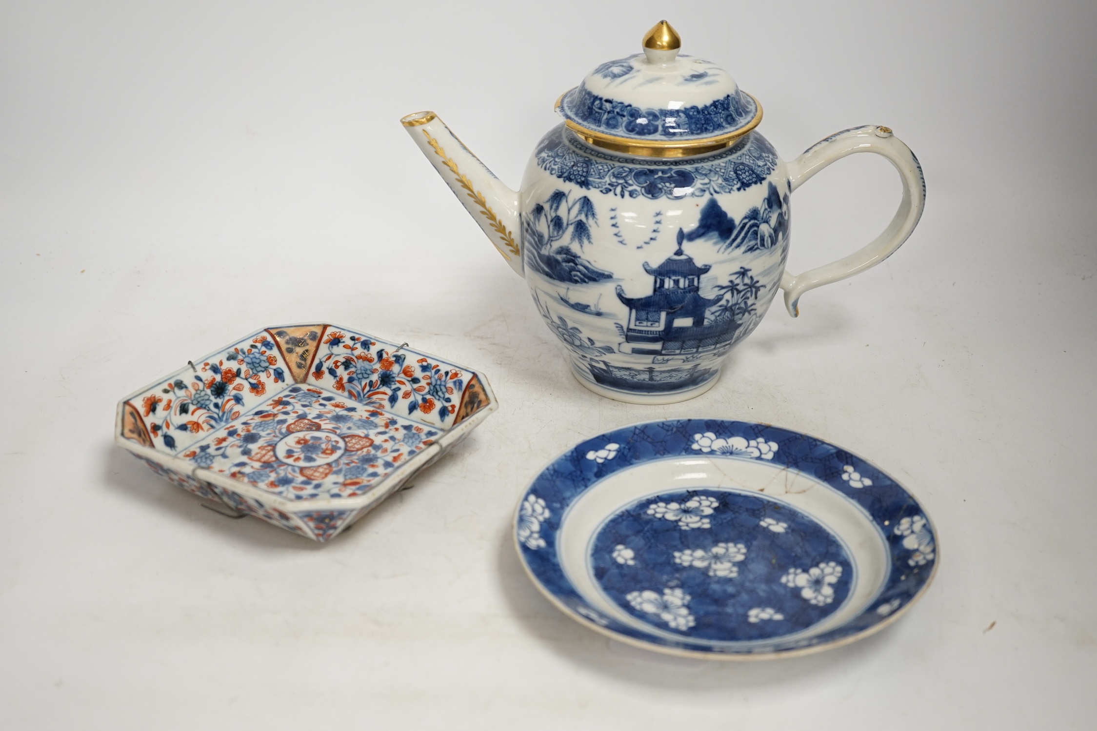A Chinese blue and white teapot and cover, a prunus dish and an Imari patterned dish, all 18th century, teapot 19cm high. Condition - prunus dish and teapot cover chipped